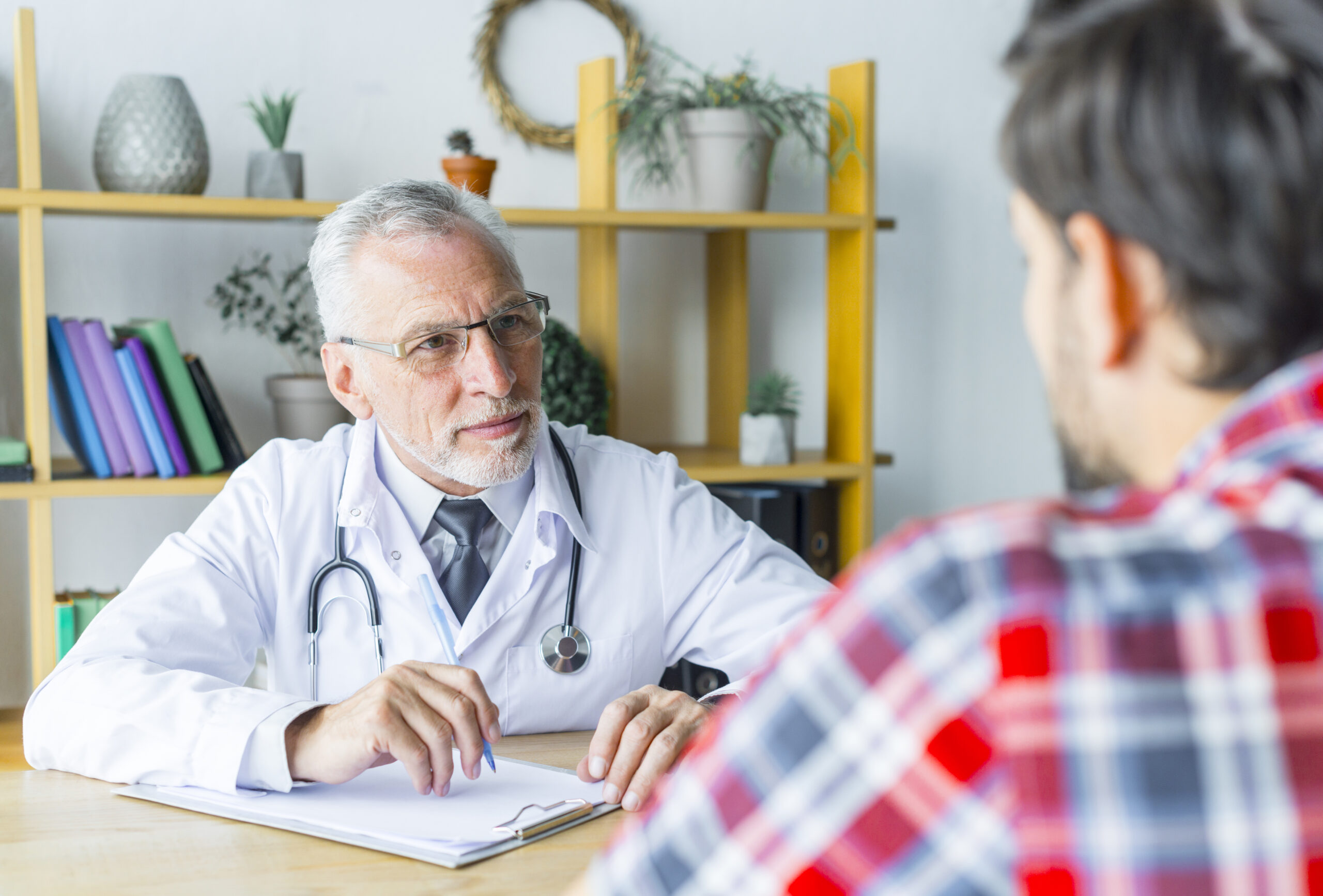 bearded-doctor-listening-patient